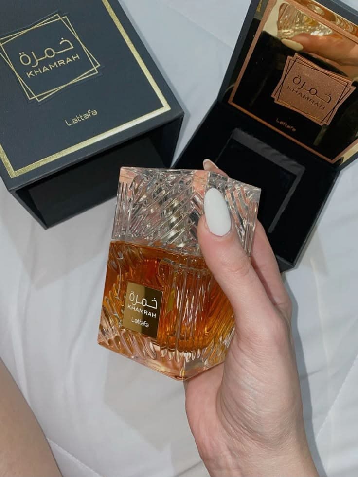 Khamrah Lattafa crystal perfume bottle held in hand